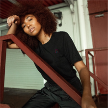 Load image into Gallery viewer,  Girl wearing North Carolina black t-shirt 

