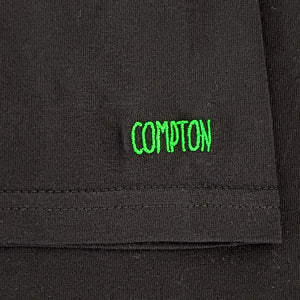 Compton embroidered on sleeve